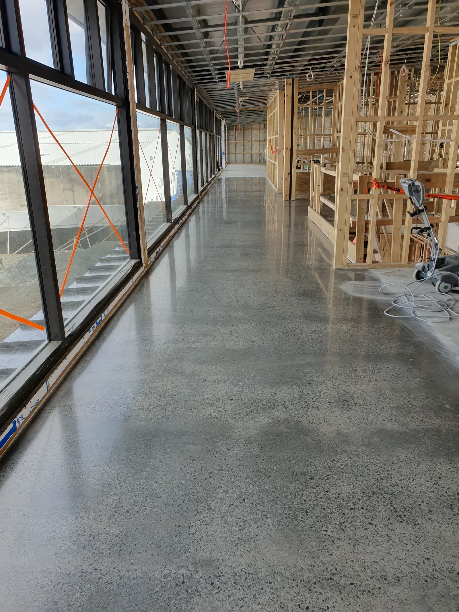 Diamond Shine Concrete light grind polished concrete floor with smooth honed finish in an Auckland new build