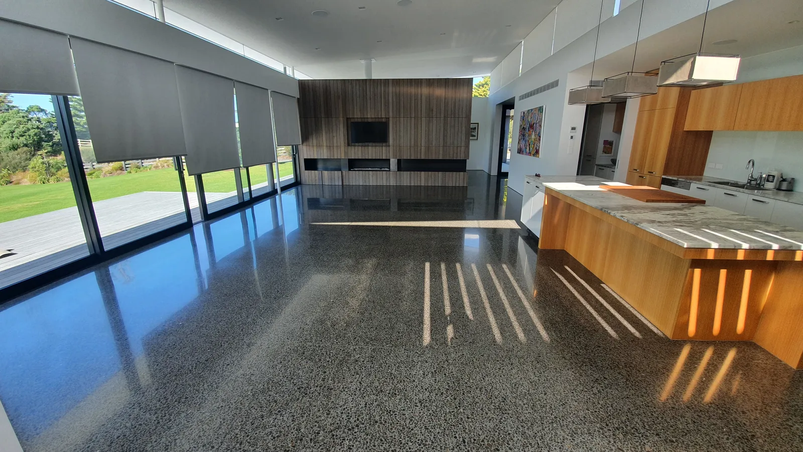 Diamond Shine Concrete polished concrete open-plan kitchen and living floor in modern Auckland home