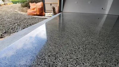 Diamond Shine Concrete semi-gloss polished concrete garage floor with exposed aggregate finish in a new Auckland home