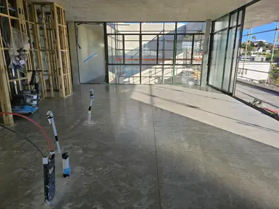 Diamond Shine Concrete polishing in progress on a concrete floor in an Auckland new build with cityscape views