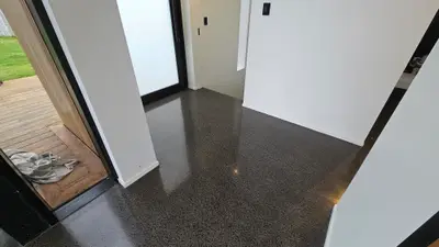 Diamond Shine Concrete polished concrete entrance floor in an Auckland home after crack repair with semi-gloss salt-and-pepper finish