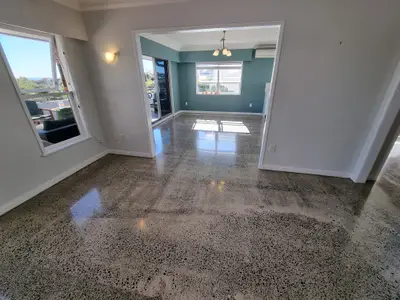 Diamond Shine Concrete polished concrete entrance floor in an Auckland home after crack repair with semi-gloss salt-and-pepper finish