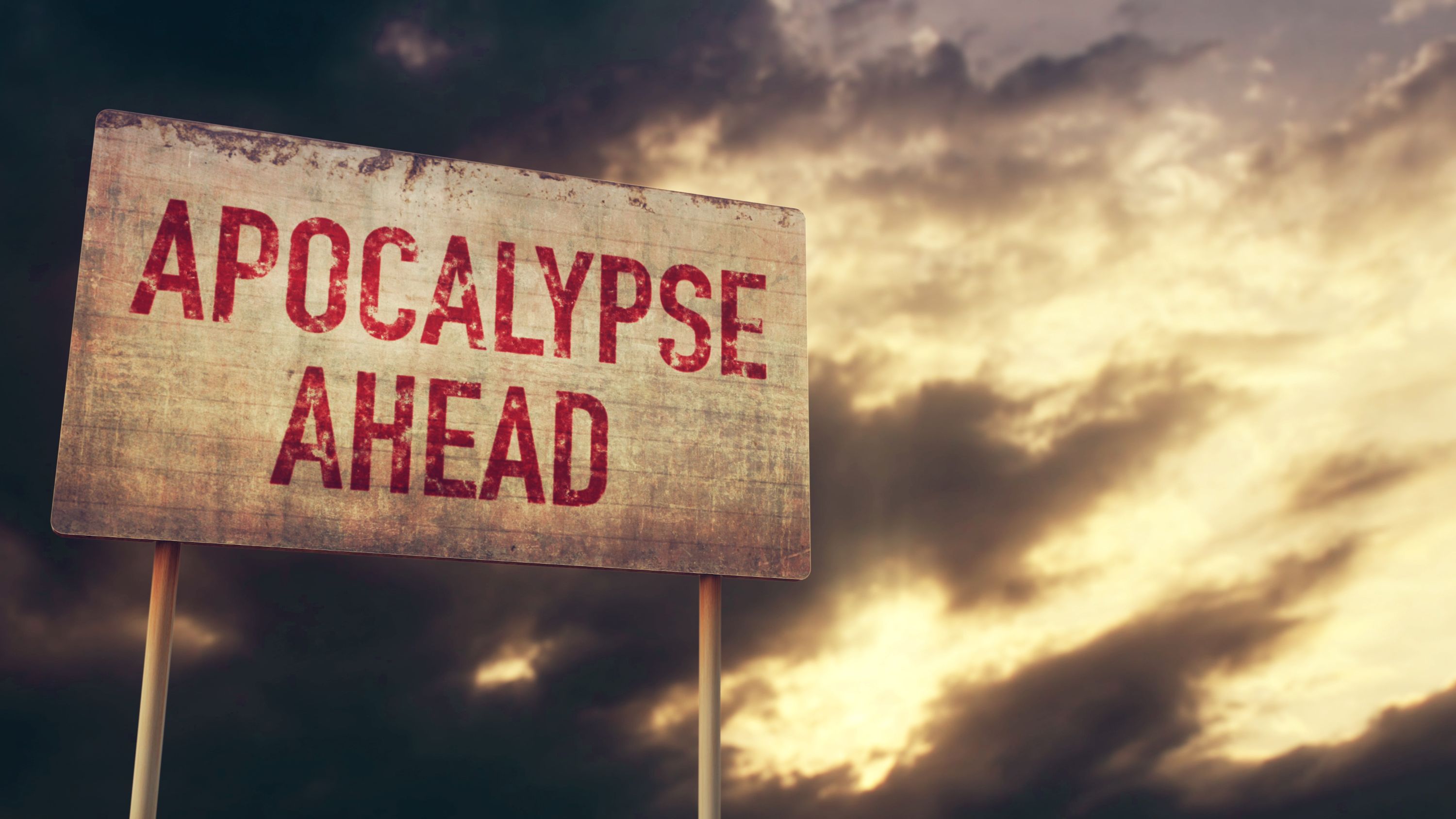 Untergangsstimmung, ein Schild im Vordergrund: "Apokalypse ahead" - Apokalypse voraus