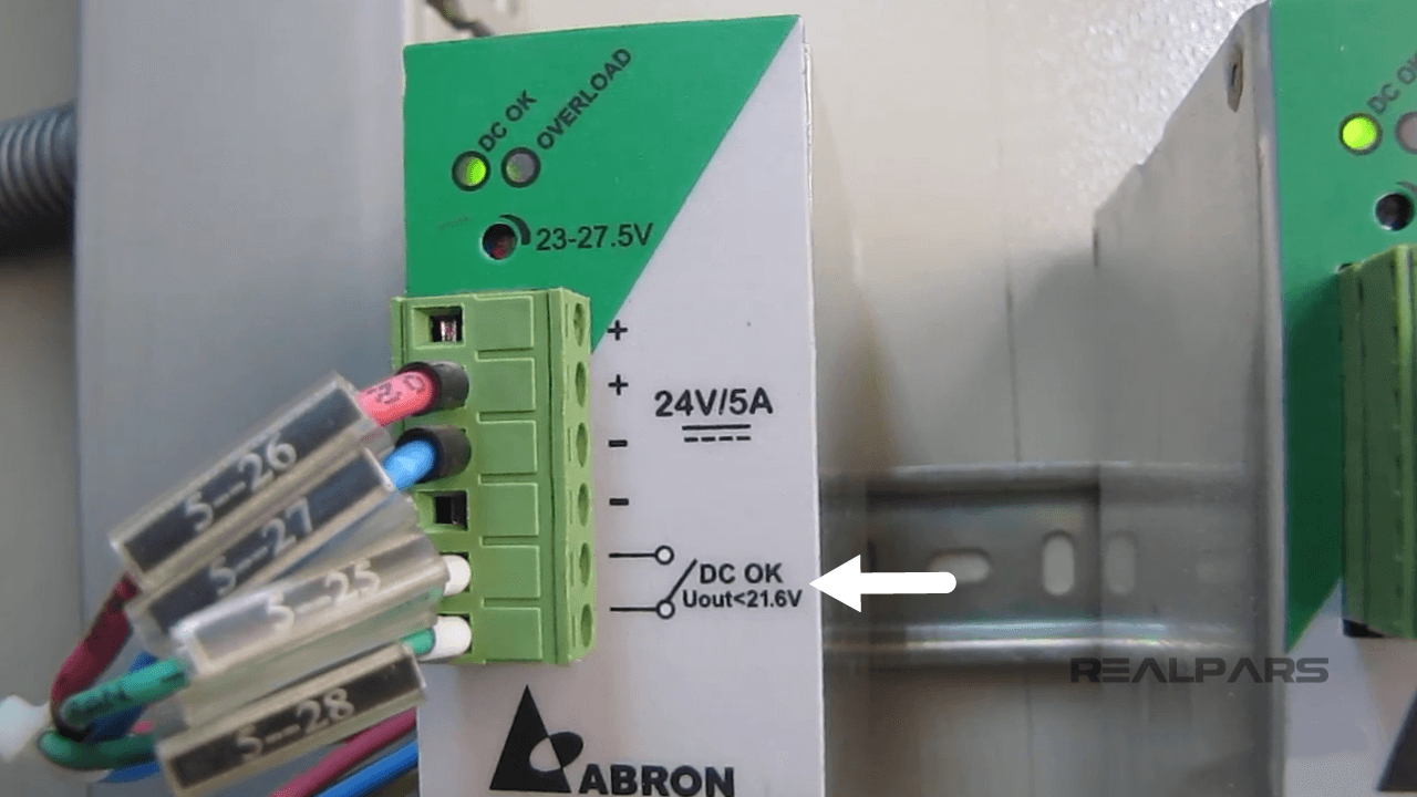 Power supply close-up showing "DC OK" and "Overload" indicators, with labeled 24V/5A output terminals and wiring.