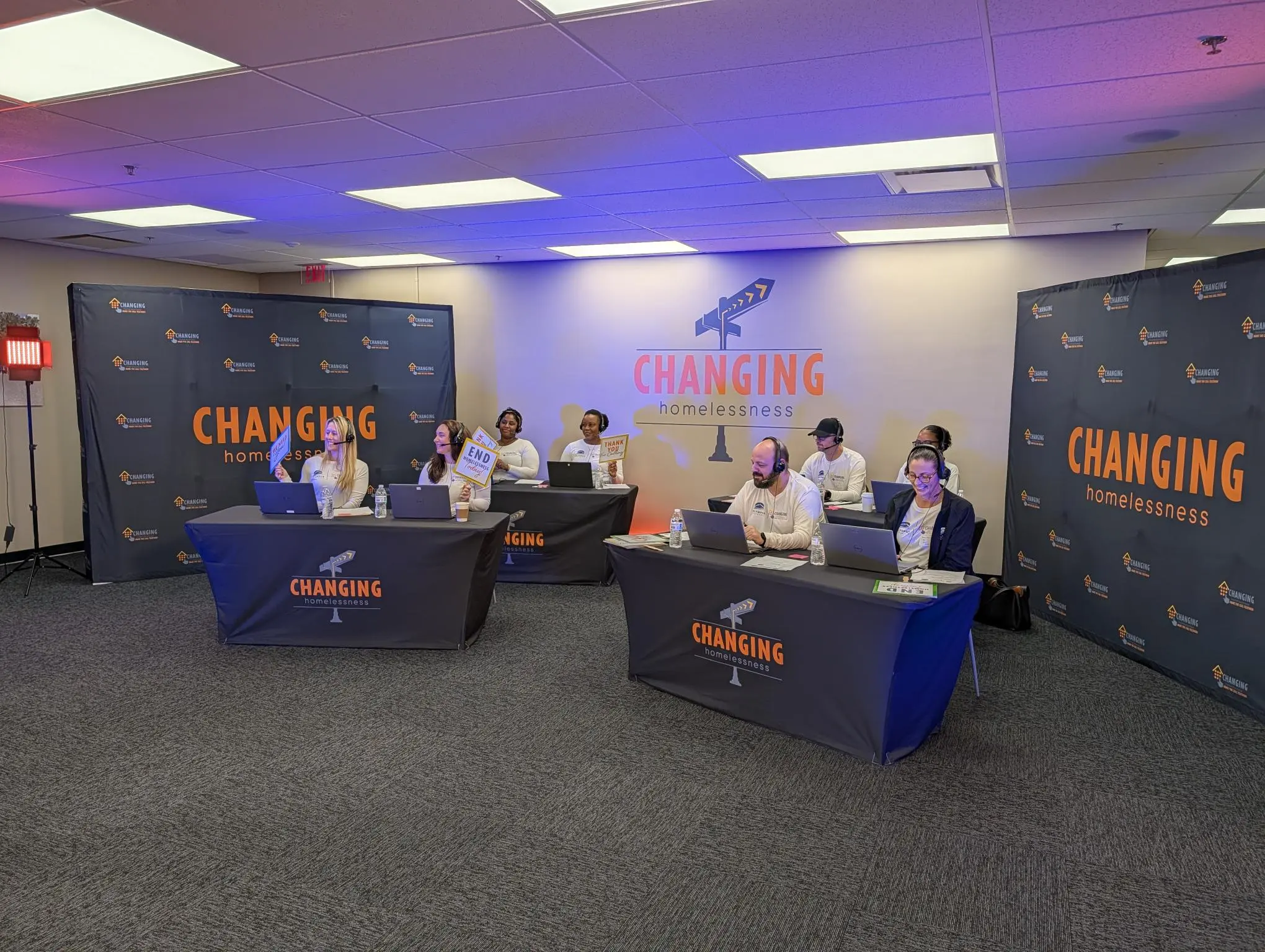 A room filled with lots of presents and a christmas tree.