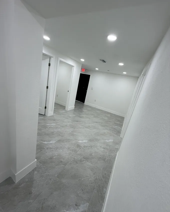 Dust free hallway with new tile floors after construction cleaning in Miami