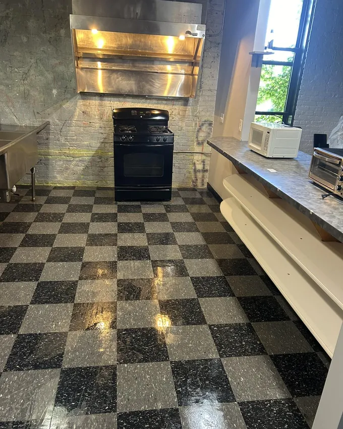 Polished checkered floor in a commercial kitchen after a professional cleaning