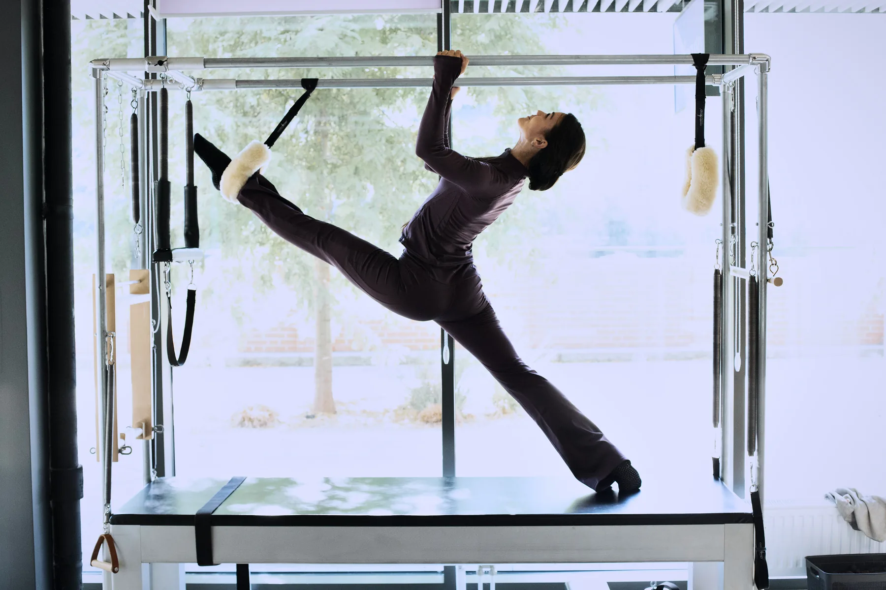 Anastazja, Pilango instructor, stretching on the Cadillac
