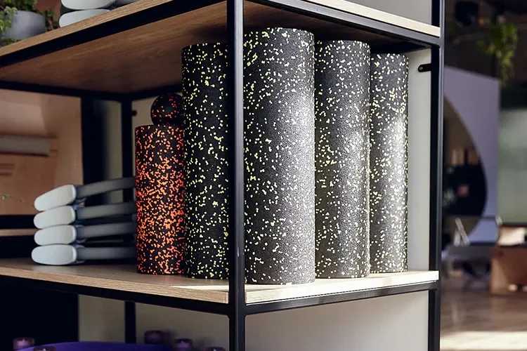 Foam rollers, rings and blocks on a shelf at Pilango Pilates Studio, Wrocław