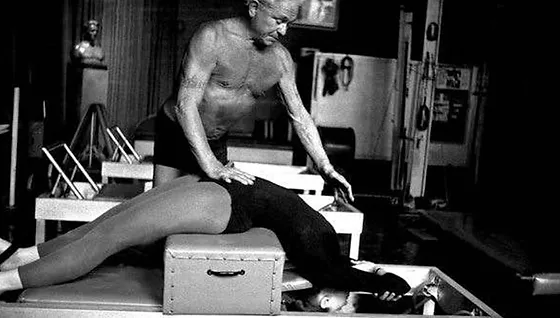 Joseph Pilates teaching on the Reformer