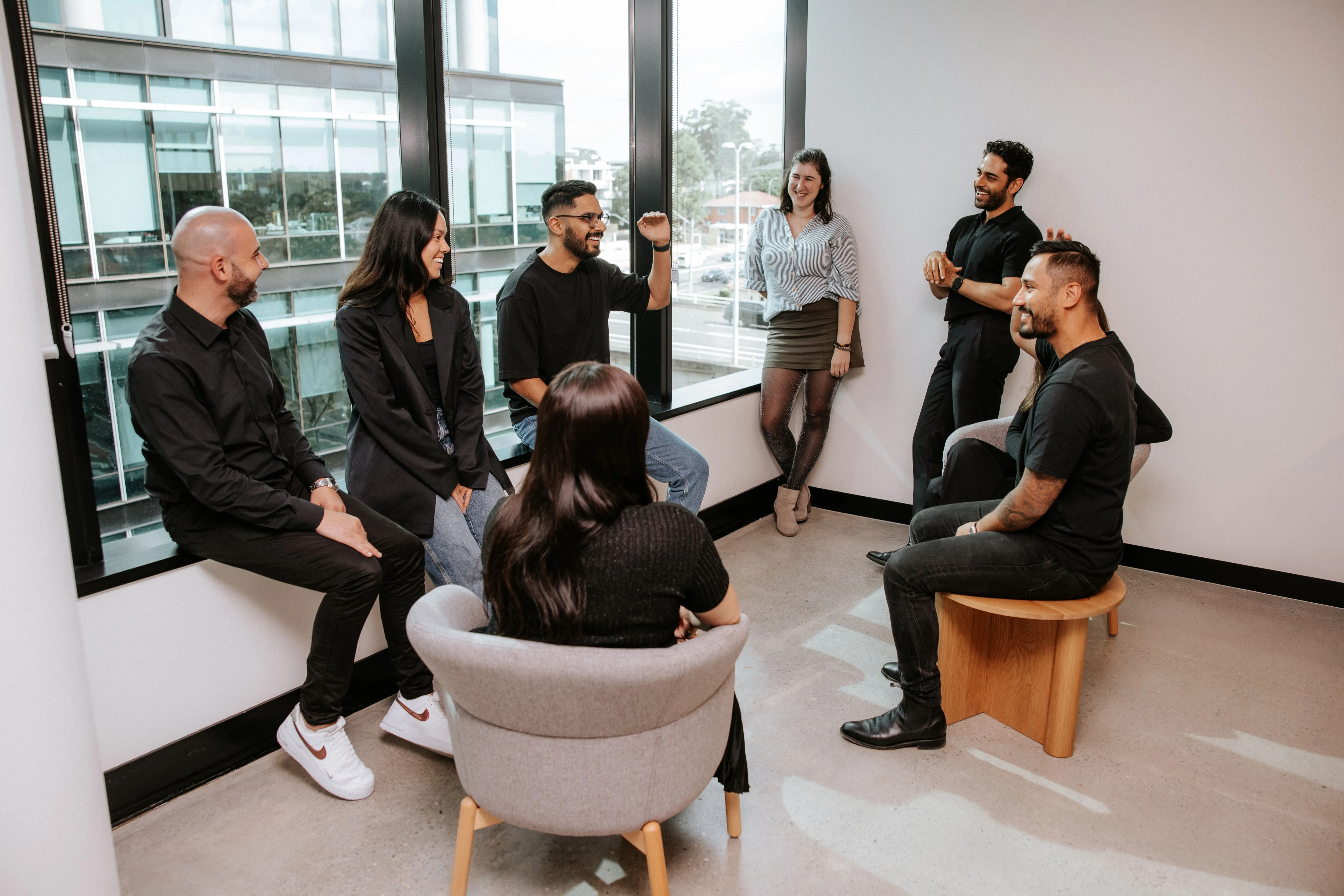 A group of people sitting in a room.