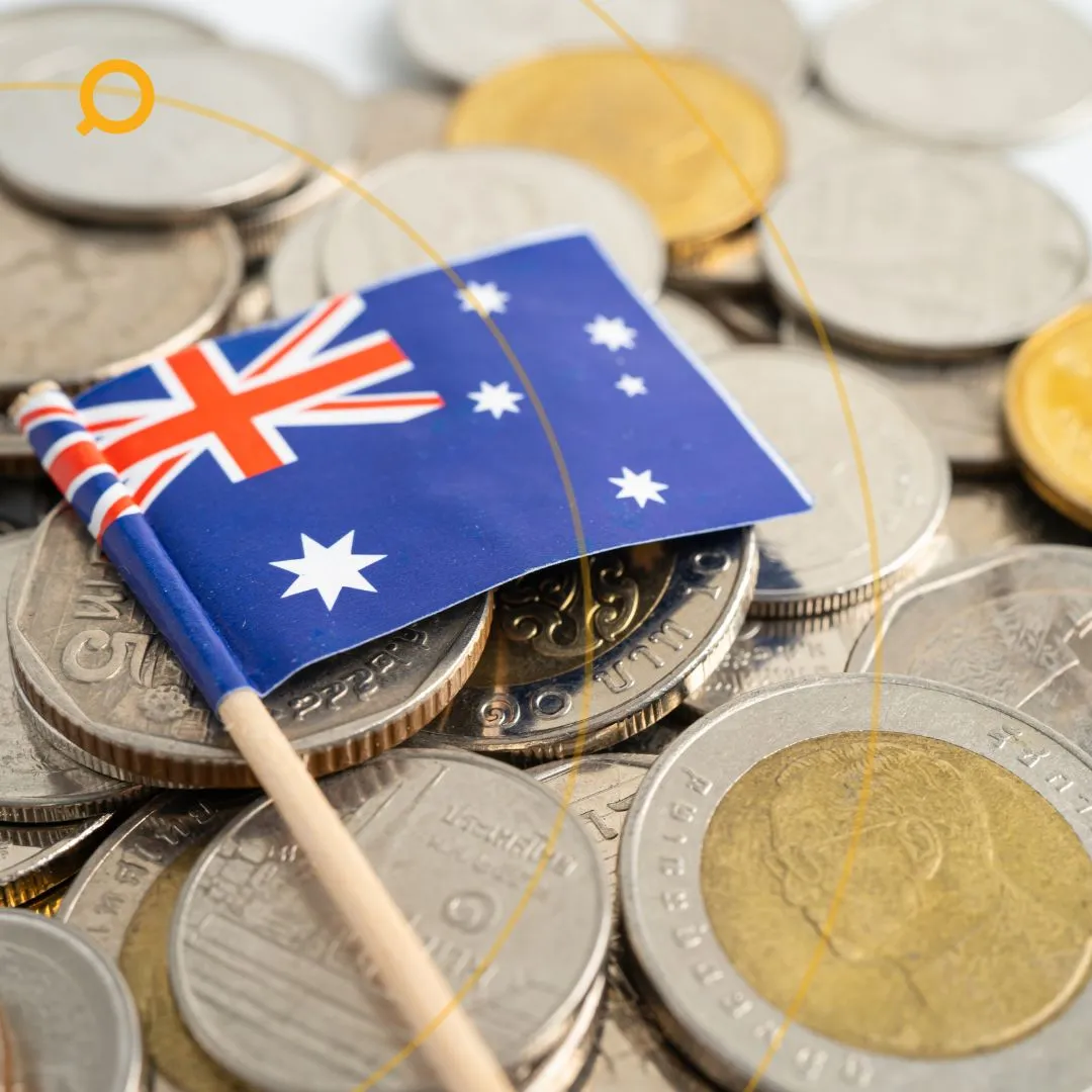 Close-up of an Australian flag on top of various Australian coins — symbolising personal finance, mortgage strategies, and savings in Australia.