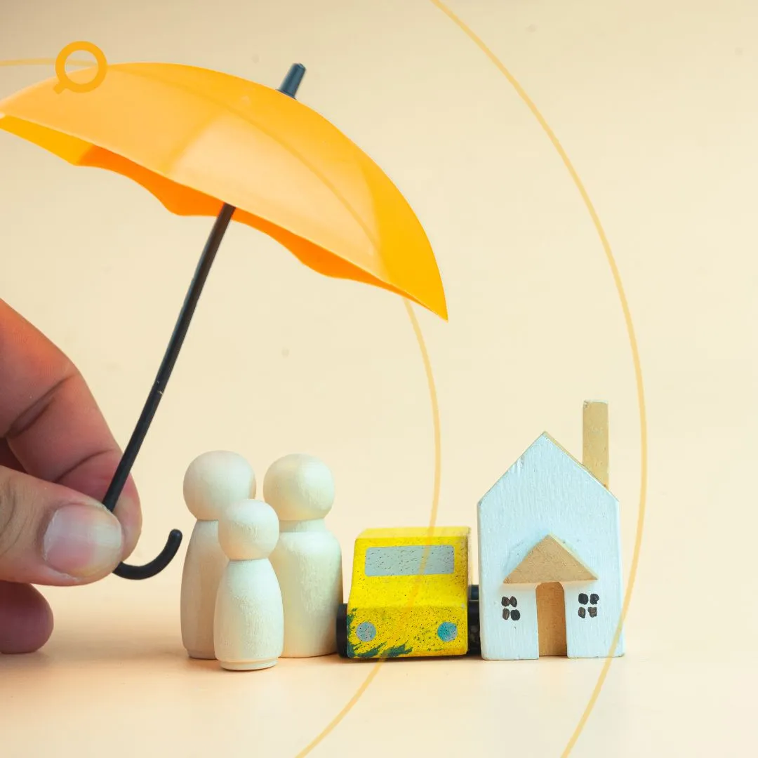 Hand holding a yellow umbrella over wooden figurines of a family, a toy car, and a small house, symbolising home, car, and family insurance protection.
