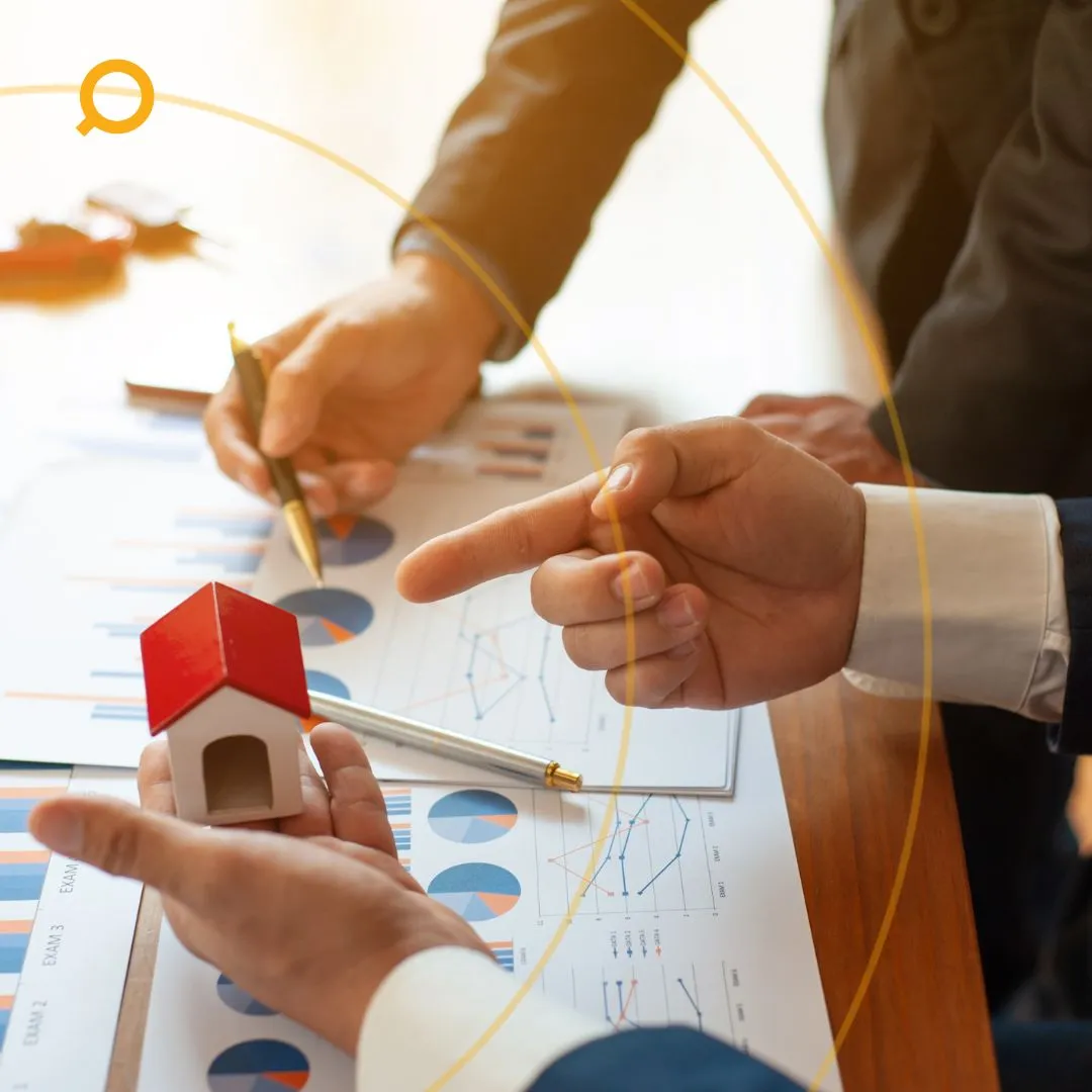 Two individuals discussing property performance 