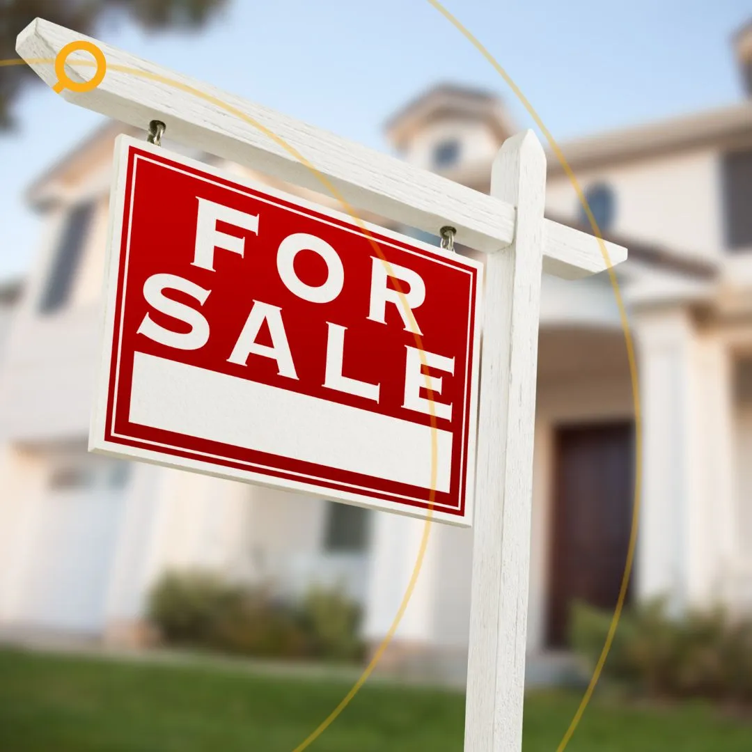 Residential house with red For Sale sign in front yard, representing property sales and real estate investment opportunities.