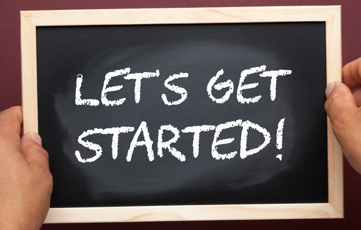 Black illustration board with a text written that says “LET’S GET STARTED”