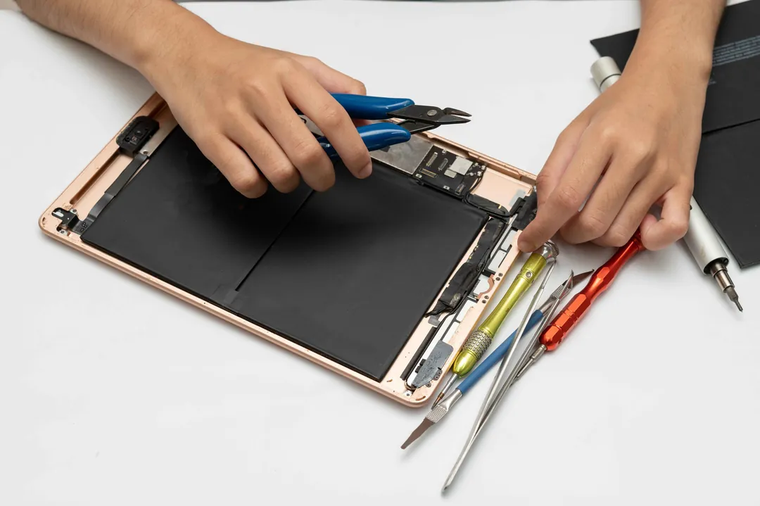 Technician repairing an iPad screen