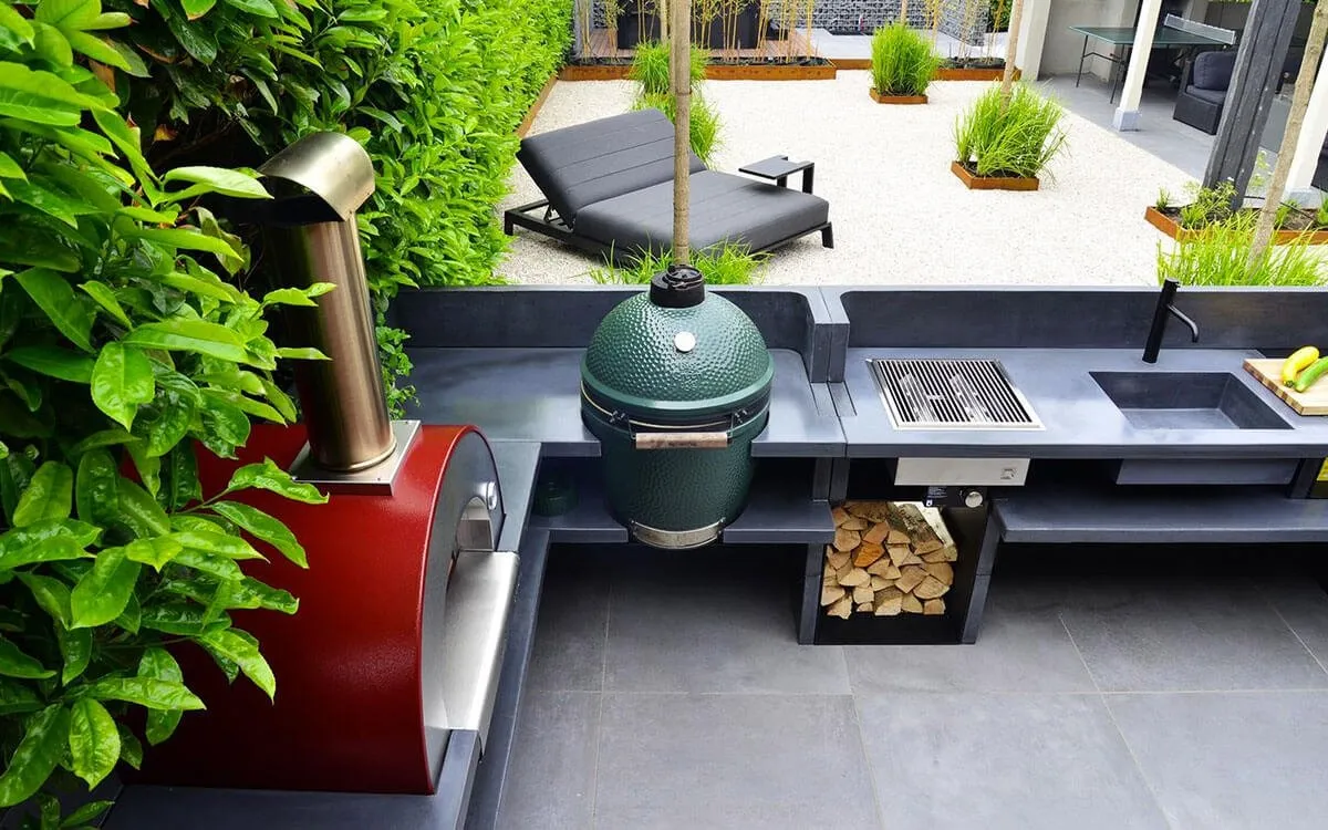 an outdoor grill with a grill on top of it