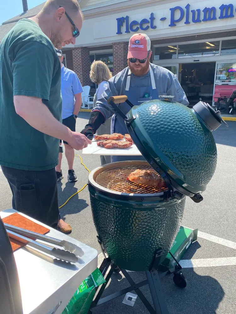 a man cooking on a grill