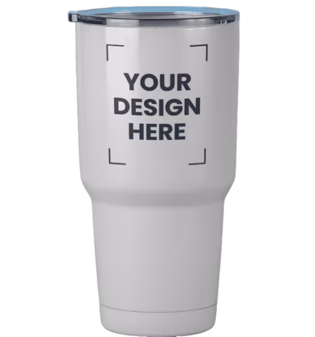 White insulated tumbler with a clear lid and placeholder text 'YOUR DESIGN HERE' framed by corner brackets.