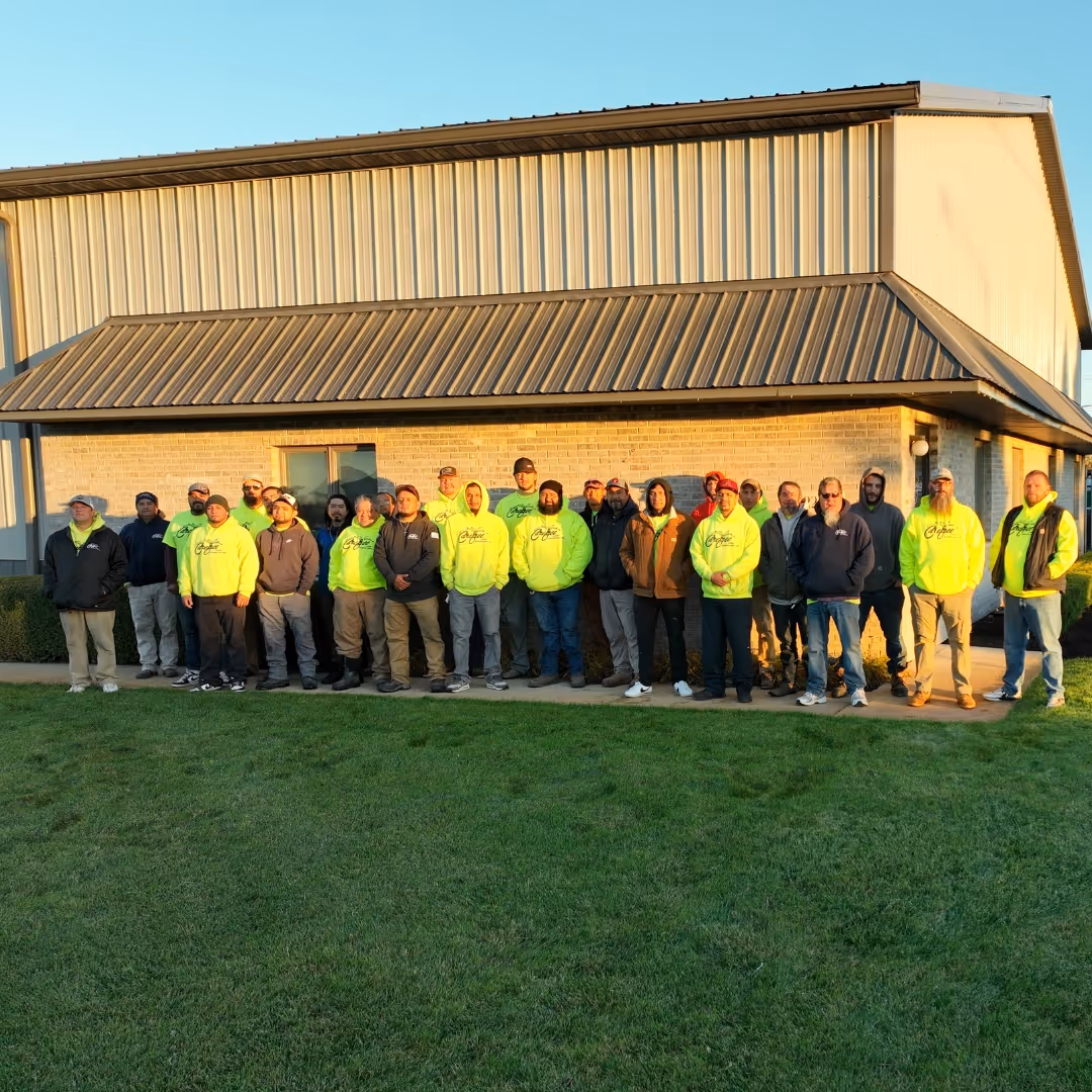 team-picture-out-front-of-office