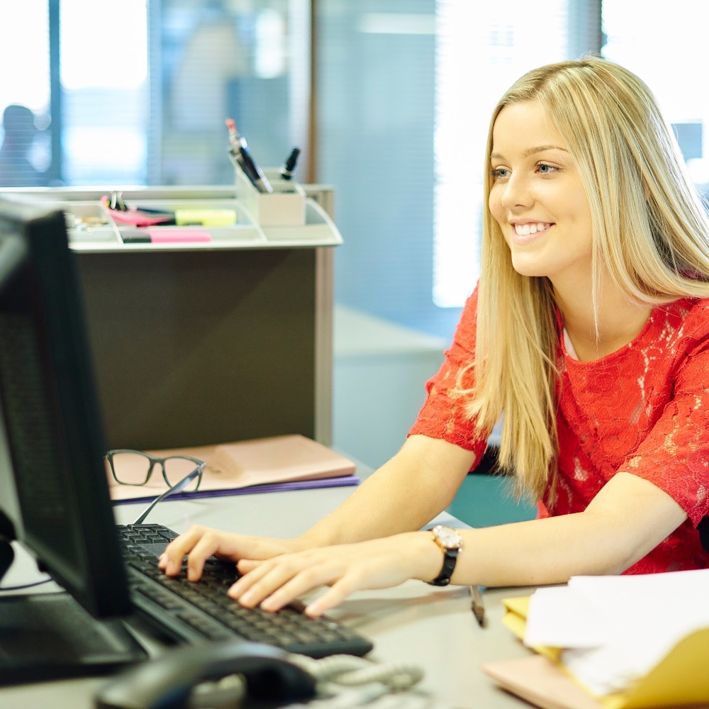 Person working at at a desktop