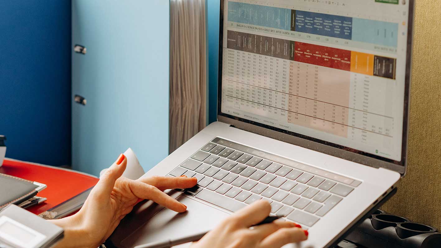 Engineer using spreadsheet software for HVAC system design before dynamic simulation