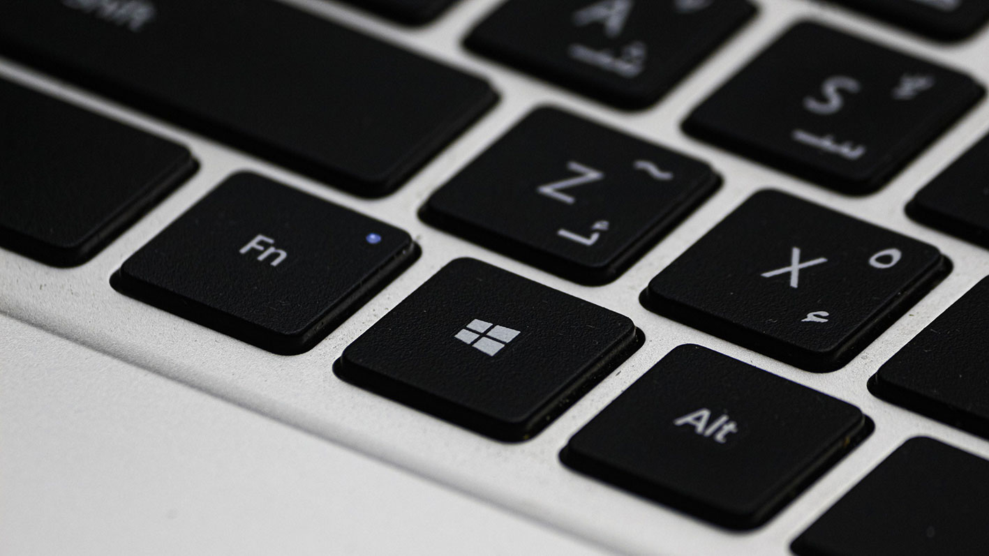 Close-up of a laptop keyboard representing the transition from Excel spreadsheets to dedicated HVAC engineering software.