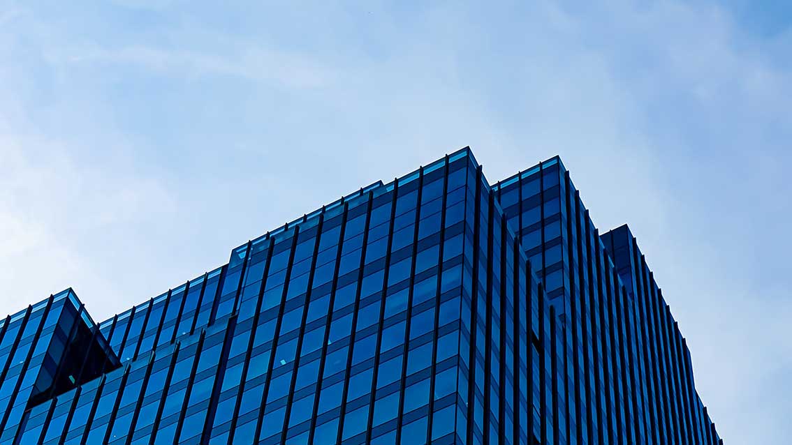 Modern office building representing hydronic HVAC projects designed with integrated HVAC engineering software.