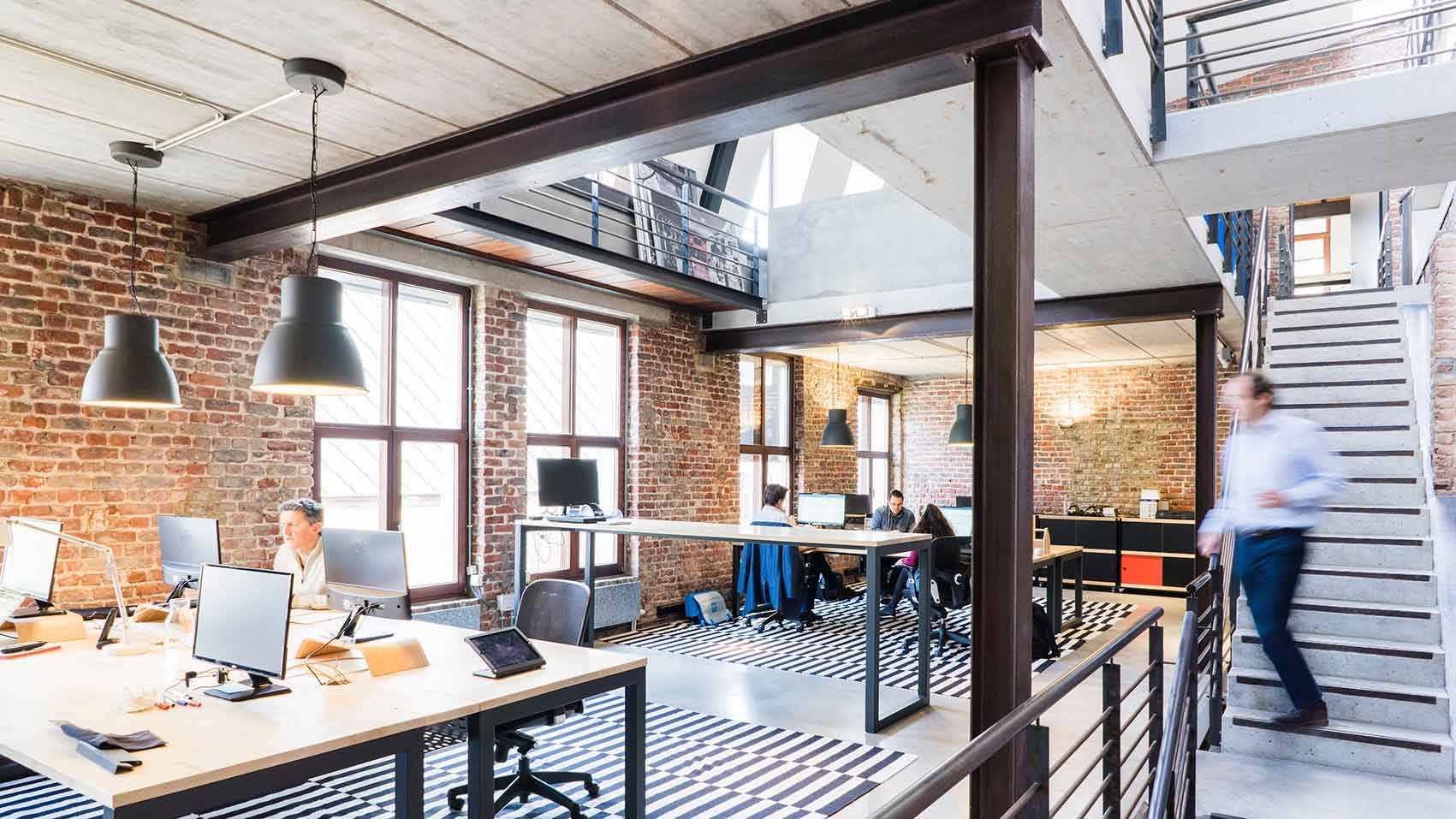 Modern office building representing integrated hydronic HVAC design workflows for design-build teams using connected engineering software.
