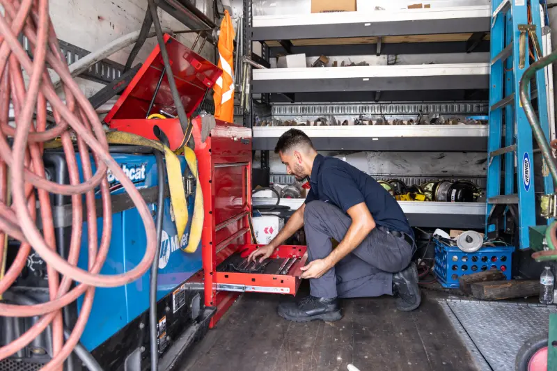 Mechanic performing mobile generator repair services in Texas
