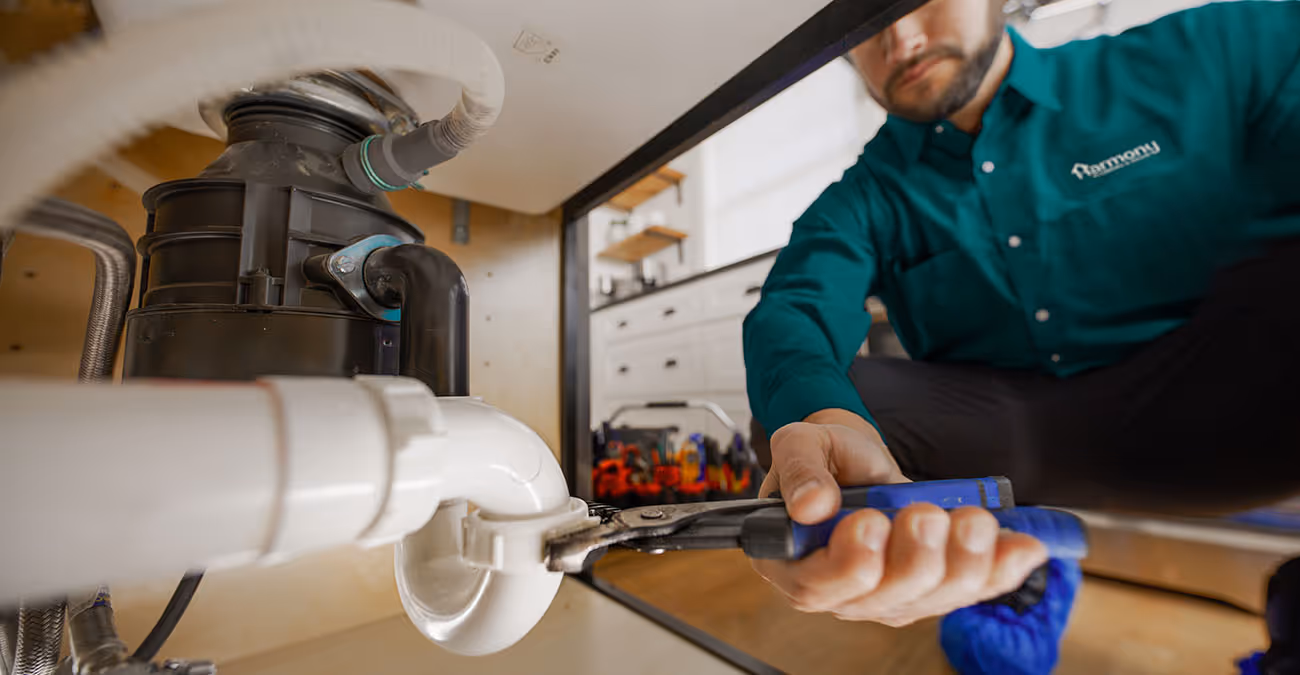 A Harmony Plumbing plumber making a plumbing repair