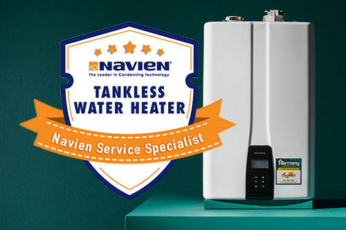 Person using a wrench to fix a leaking white kitchen pipe under a sink with water flowing out.