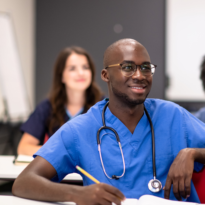 Student in classroom excited about nephrology nursing