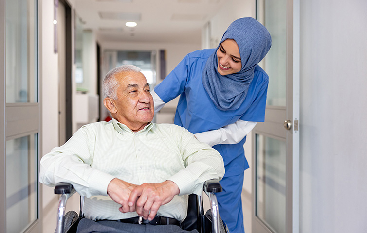 Nurse in hijab with patient