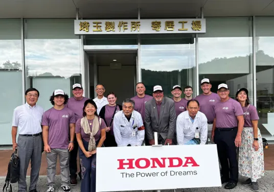 A group of people standing in front of a building.