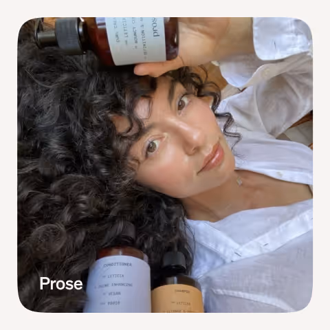 a girl poses with products from prose