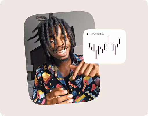 A man with dreadlocks is pointing at a graph.