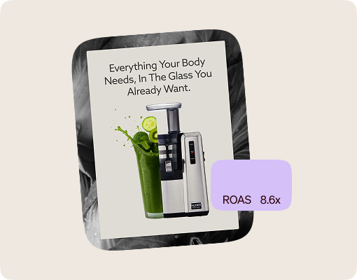 A green smoothie is blended in a glass.
