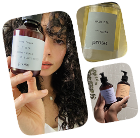 A woman holding a bottle of hair oil.