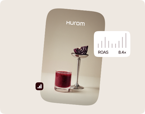 Hurom ad featuring a glass of fresh juice beside a performance chart showing an 8.4x ROAS.