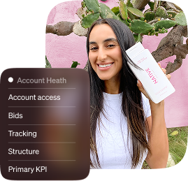 Smiling woman holding a skincare product beside an account health checklist covering access, bids, tracking, structure, and primary KPI.