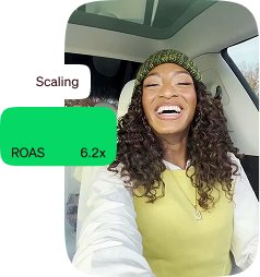 Smiling woman sitting in a car beside a scaling metric showing a 6.2x ROAS.