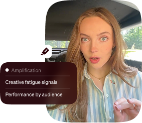 Woman speaking in a car beside an amplification dashboard showing creative fatigue signals and audience performance.