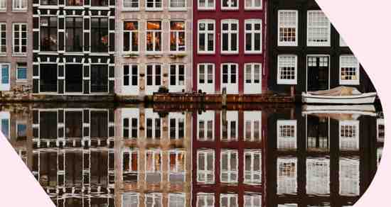 A reflection of a building in a body of water.