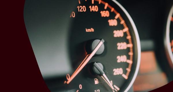 A red speedometer with the number 120 on it.