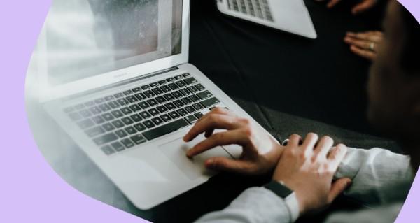 A person is typing on a laptop.