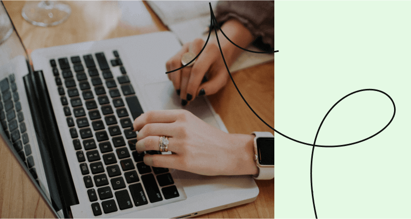 A person is typing on a laptop computer.