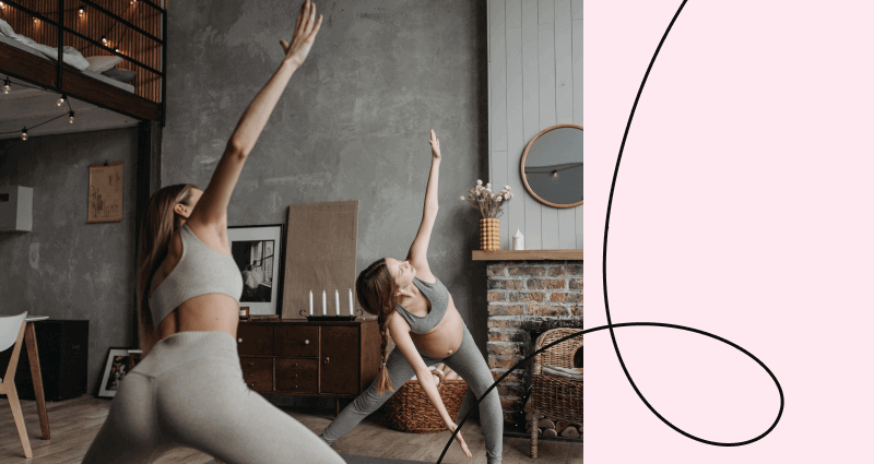 A woman in a grey shirt doing yoga.