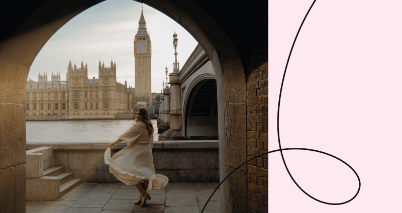 A woman in a white dress is dancing in front of Big Ben.